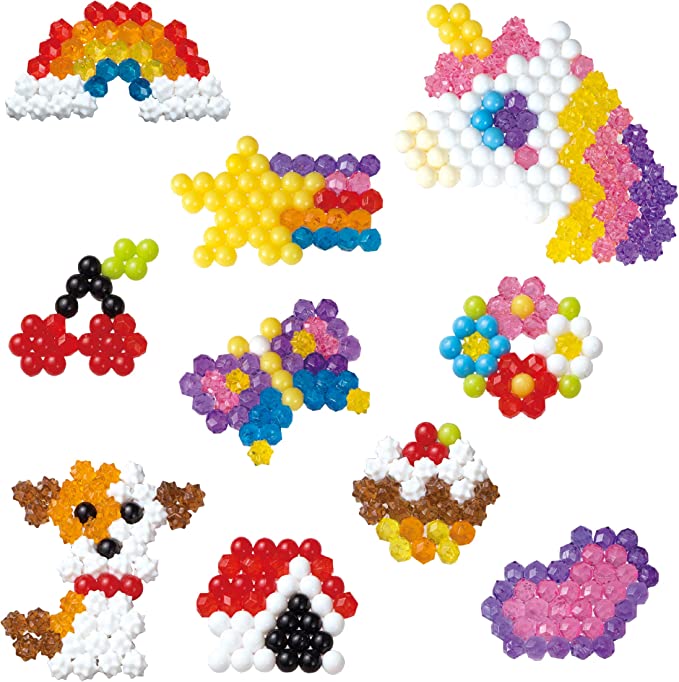  AquaBeads Dinosaur World - Arts & Crafts Kit for Kids Ages 4+ -  Includes Over 1200 Shiny Beads, Layout Tray, Sprayer, Creation Display,  Design Pegs, Keychain Accessories, and Template Sheet, Small 